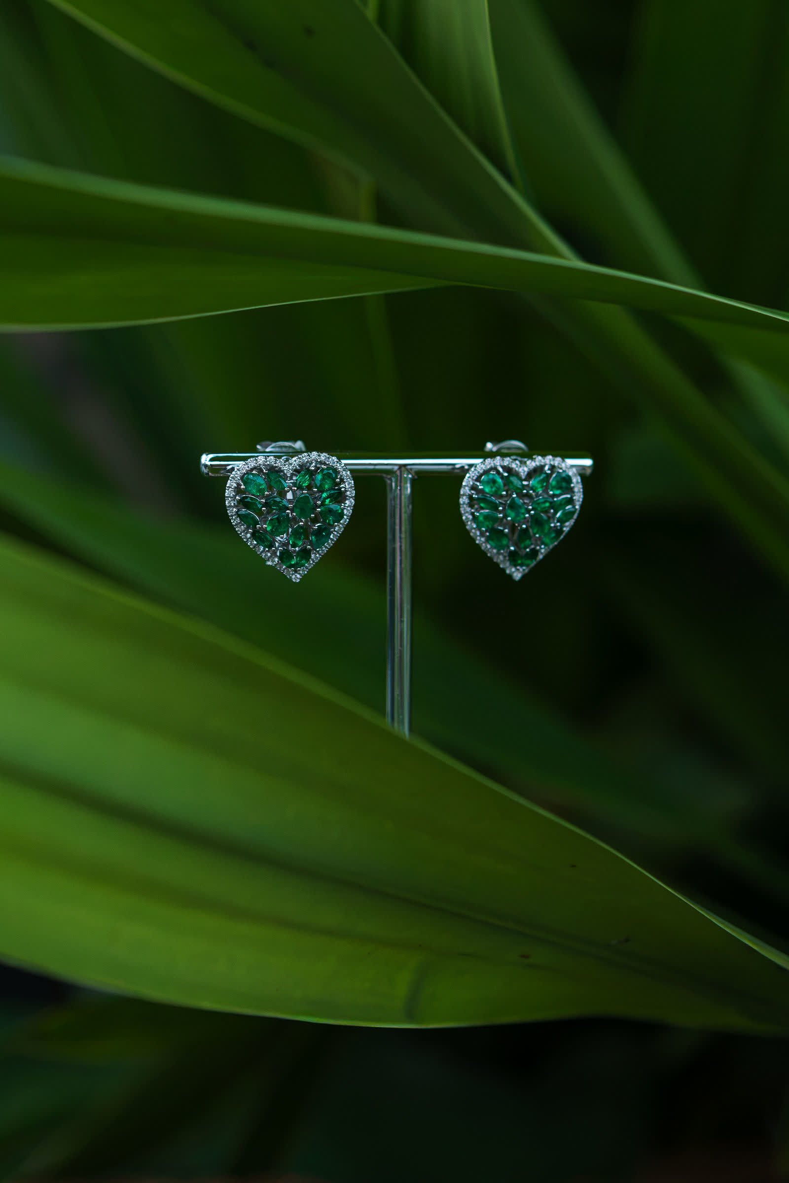 Emerald Heart Earrings — Emerald hearts traced by diamonds.